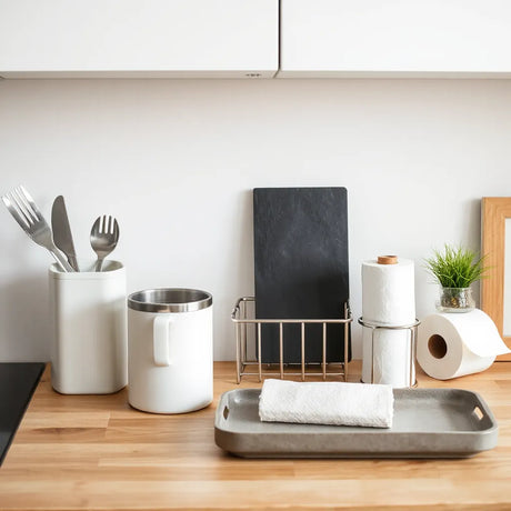 Modern kitchen countertop with organised utility tools, storage containers, and a drying rack