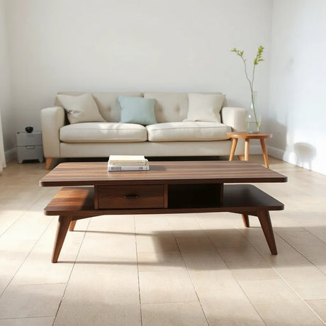 Modern living room with stylish coffee tables in dark wood and round accents
