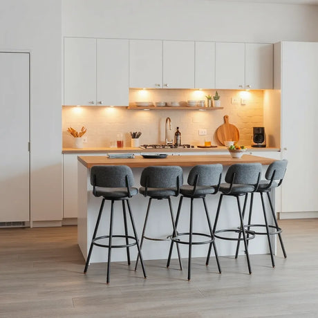 Stylish bar stools around a kitchen bar with warm lighting for hosting