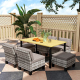 Steel 7 Pieces Garden Dining Set With 4 Poly Rattan Armchairs And 4 Footstools - Velmora