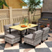Steel 7 Pieces Garden Dining Set With 4 Poly Rattan Armchairs And 4 Footstools - Velmora